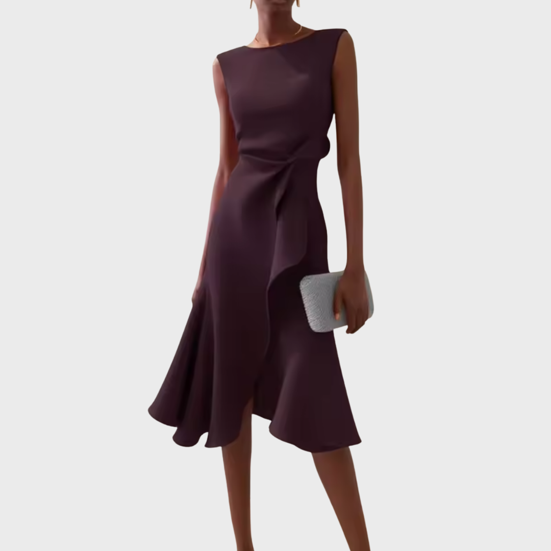 Woman model presenting a stylish wrap dress with an asymmetrical hem.