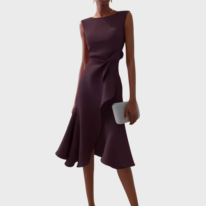 Woman model presenting a stylish wrap dress with an asymmetrical hem.
