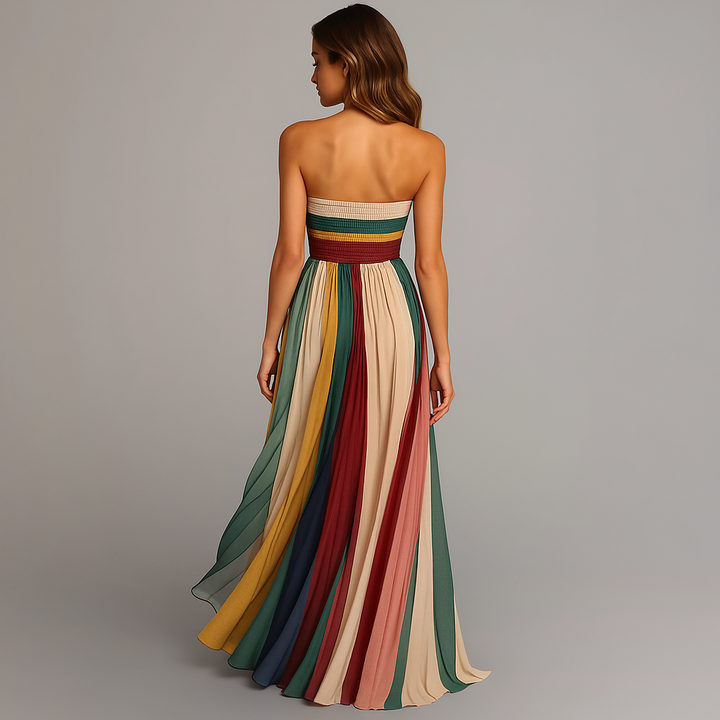 Model wearing an elegant strapless maxi dress in a clean studio setting, back view angle