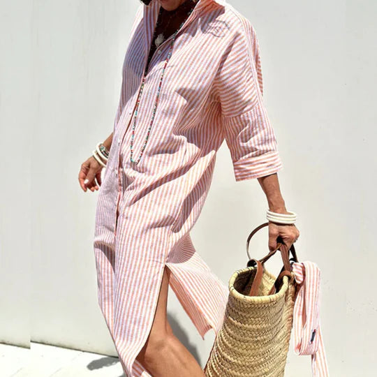 Woman model styled in a women’s striped midi dress on a clean background.