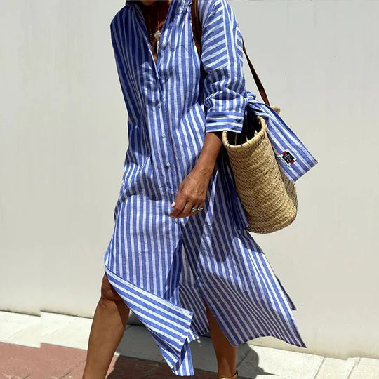 Woman model wearing a striped shirt midi dress against a clean plain background.