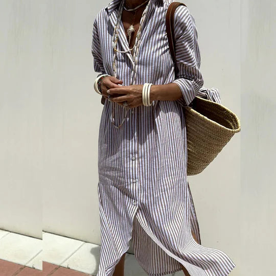 Model wearing a chic striped shirt dress with a flattering waist belt.