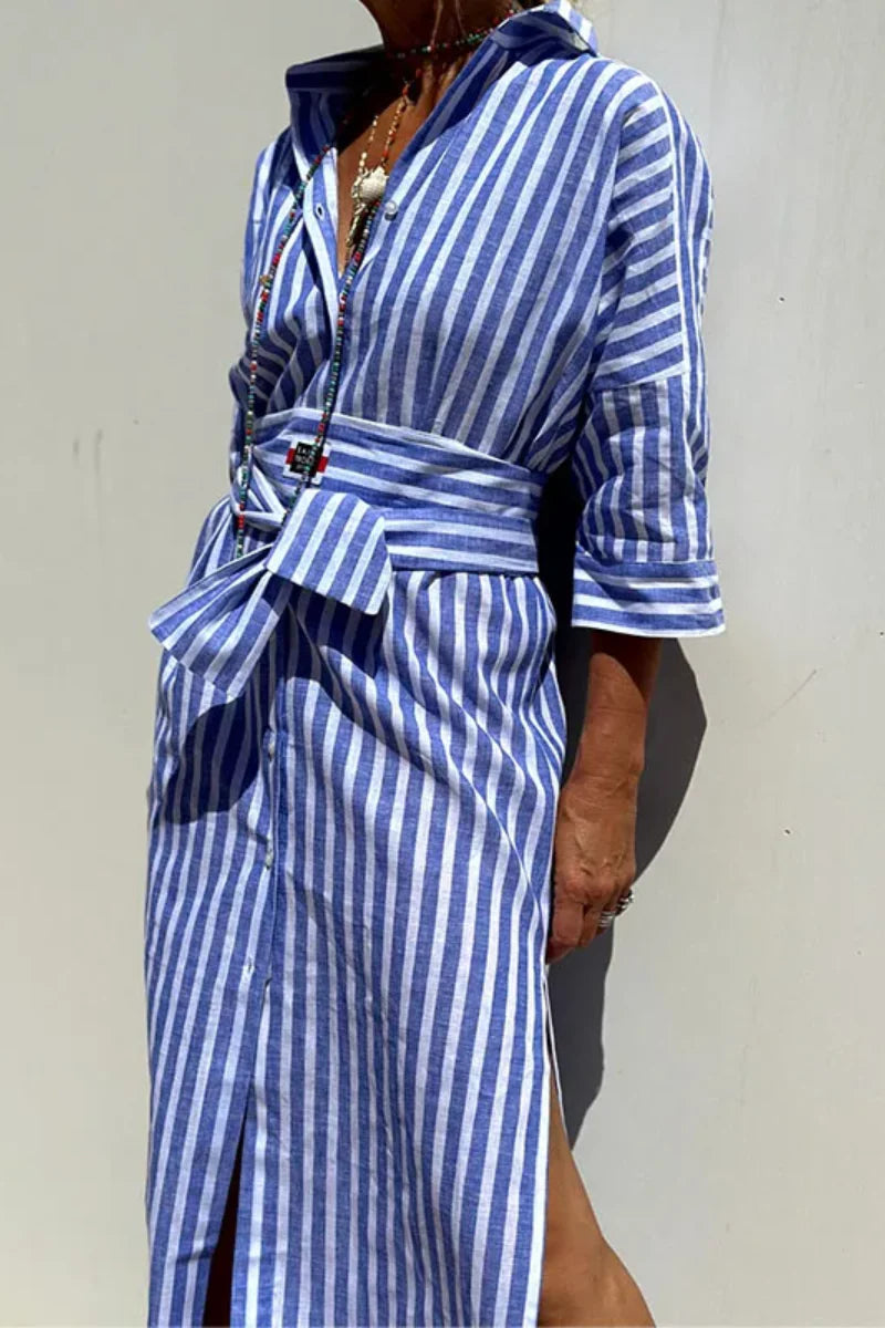 Model in a belted striped midi shirt dress on a plain background.