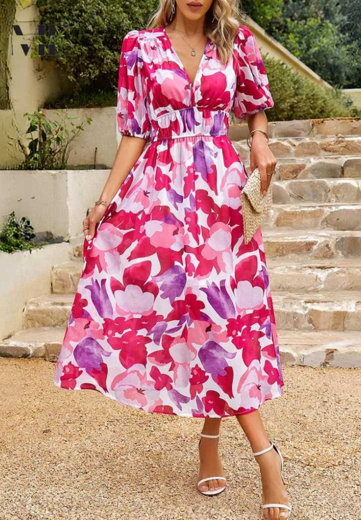 Easy wear floral midi dress for women modeled on a staircase background.
