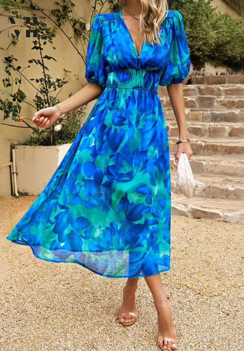 Woman model wearing a comfortable floral midi dress with puff sleeves and elastic waist.