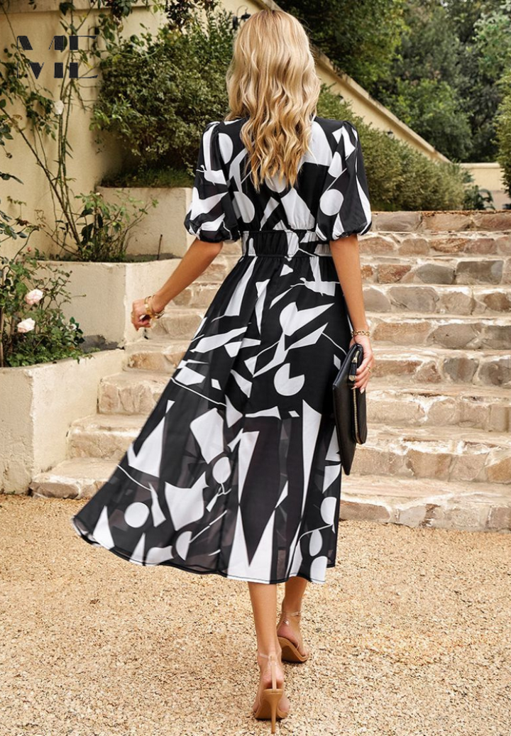 Woman model in a true-to-size floral midi dress for casual and daily wear, back view