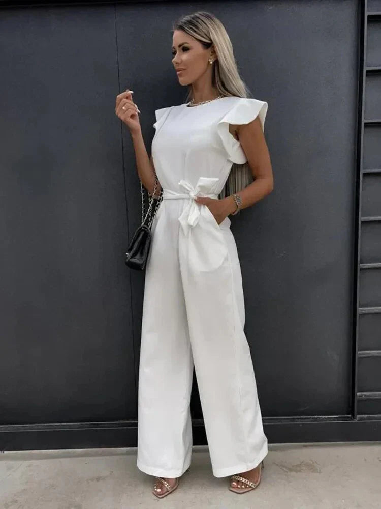 Model front pose with ruffle sleeves detail plain background