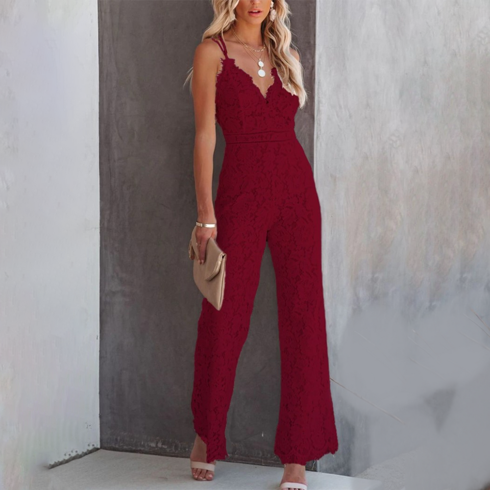Model standing full body showcasing wide leg outfit plain background